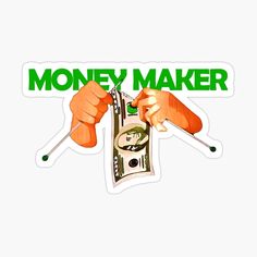 the money maker sticker is being held up by two hands and holding a pair of scissors