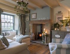 a living room filled with furniture and a fire place