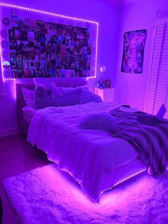 a bedroom with purple lighting and pictures on the wall above the bed is lit up