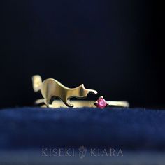 14K Solid Gold Cute Kitty Birthstone Ring, Custom Gemstone Cat Ring, Cats Playing Yarn Ball, Cat Stuff for Cats Lover, Unique Cat Jewelry DETAILS ♡⃛ ⃛ Main stone: Ruby or other birthstones Side stone: - Band width: 1.5mm Band thickness: 1.2mm OUR GEMSTONES ♡⃛ ⃛ At Kiseki Kiara, we use both precious and semi-precious stones throughout our jewelry designs, with each stone set-by-hand in our workshop. We carefully source gemstones for their quality and color ensuring you receive the best quality st Anniversary Cat Design Rings, Gold Cat Design Jewelry For Anniversary, Cat Design Jewelry Ring As A Gift, Elegant Cat Design Ring Jewelry, Playful Pink Cat Design Jewelry, Luxury Jewelry Box, Cat Ring, Unique Cats, Cat Jewelry