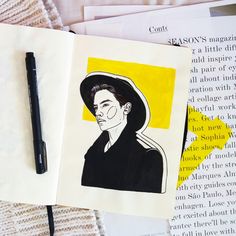 an open book with a drawing of a man wearing a hat on top of it