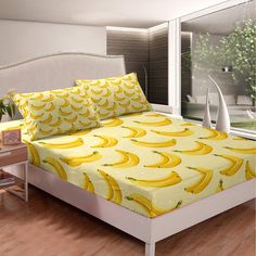 a bed room with a neatly made bed and lots of yellow bananas on the sheets