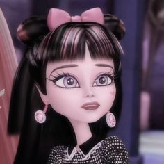 an animated doll with big blue eyes and long black hair, wearing pink earrings