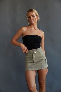 This Item is excluded from promotions. You'll be giving ultimate "cool girl" vibes in the Darcey Belted Cargo Mini Skirt! This cargo-style mini skirt features a detachable belt with a silver belt buckle, silver grommets, and a mini side pocket. Available in white, black, and tan. Pair with a cute crop top to complete the look! Details 60% Rayon, 37% Cotton, 3% Spandex Zipper and button fly Dry clean only Cargo Mini Skirt, Belted Mini Skirt, Cute Crop Top, Silver Belt Buckle, Silver Belt, Cargo Style, Cargo Skirt, Cute Crop Tops, Casual Everyday