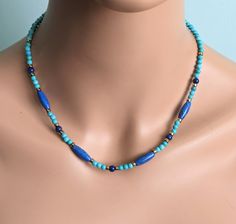 The necklace is made of 15 mm. barrel and 5 mm. lapis lazuli beads, 4 mm. turquoise beads and adorn gold tone Japanese spacer beads.   A length is 16  - 18'' ( 40 - 47.5 cm. ).  The necklace will be packaged in a gift box.   Your jewelry is ready to ship.   Thank you for visiting my shop. Spiritual Blue Turquoise Necklace With Spacer Beads, Turquoise Lapis Lazuli Beaded Necklace With Round Beads, Turquoise Lapis Lazuli Beaded Necklace, Turquoise Lapis Lazuli Beaded Necklace With Polished Beads, Spiritual Blue Turquoise Necklace With Faceted Beads, Blue Single Strand Necklace With Oval Beads, Turquoise Lapis Lazuli Necklace With Polished Beads, Blue Turquoise Gemstone Beads Necklace For Spiritual Style, Blue Single Strand Lapis Lazuli Beads