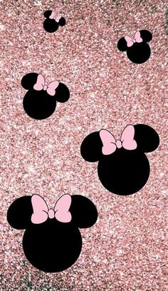 minnie mouse ears with pink bows on glittery background in the shape of three hearts