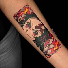 a woman's arm with an anime character tattoo on the left side of her arm