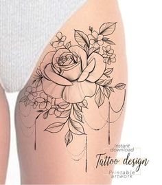 a woman's thigh with tattoos and flowers on it