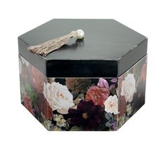 a black box with flowers on it and a tassel hanging from the top,