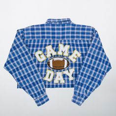 Get ready to tackle game day with our personalized football button-down Oxford - perfect for tailgating, pep rallies, and showing off your school spirit in style! Our shirt from Beyond Vintage Co is the ultimate way to make a statement on game day and show your support for your favorite team! Features: Personalized Design:  Each shirt is made to order. Each shirt is unique so that you can make it truly your own! High-Quality Fabric:  Made with premium quality fabric, your button-down Oxford is comfortable, breathable, and durable enough to withstand all the excitement of game day. Versatile Style:  Dress it up or dress it down with your choice of jeans, khakis, or slacks - this customizable shirt is perfect for any occasion! 👕 Repurposed Shirt Option:  Our *repurposed* shirts come in all Casual Tops For School Football Season, Cotton Sports Fan Shirt For Game Day, Sports Fan Shirt For Game Day, Cotton Team Spirit Shirt For Game Day, Game Day Football Shirt For Sports Fans, Game Day Team Spirit Cotton Shirt, Cotton Sports Fan Shirt For College, Homecoming Pep Rally, Team Spirit Shirts