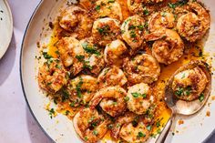 a pan filled with cooked shrimp and sauce