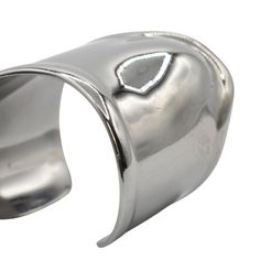 Tiffany & Co. x Elsa Peretti 'Medium Bone Cuff' bracelet in gunmetal tone 925 sterling sivler with an organic asymmetrical design. Brand = Tiffany & Co. Size = Medium Condition = 7.5/10, Very good. Light scratching throughout, faint tarnishing. Material = Sterling silver Dimensions = 61mm SKU = 4450-103 Modern White Gold Cuff Bracelet With Shiny Finish, Silver Stainless Steel Bangle With Polished Finish, Elegant Gunmetal Metal Bracelets, Elegant Gunmetal Metal Bracelet, Modern Adjustable Cuff Bracelet With Shiny Finish, Luxury Silver Stainless Steel Bangle, Formal Stainless Steel Cuff Bracelet With Polished Finish, Modern Adjustable Shiny Cuff Bracelet, Modern Gunmetal Bracelets For Formal Occasions