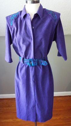 "Here is a wonderful short sleeve dress by S.L. Fashions. 100% polyester and made in the USA. Vivid purple fabric with green and blue floral accents on the shoulders, and matching green and blue belt. Four button front in the blouse section, 7\" zipper in the front of the skirt section. Shoulder pads present. It's in excellent shape with tons of life left! The tag says size 12, but here are the exact measurements. (be sure to reference the last photo to see how I measure dresses) Here are the me Blue Belt, Vintage Short, Purple Fabric, Vintage Shorts, Short Sleeve Dress, Green And Blue, Dress Clothes For Women, Shoulder Pads, Blue Floral