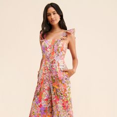 Floral Jumpsuit Outfit Wedding, Floral Wedding Jumpsuit, Summer Jumpsuit Outfit Classy, Cute Colorful Outfits Summer, Floral Print Jumpsuit For Spring Garden Party, Flirty Floral Print Jumpsuit For Party, Chic Floral Print Beach Jumpsuit, Chic Pink Floral Print Jumpsuit, Summer Jumpsuit Outfit