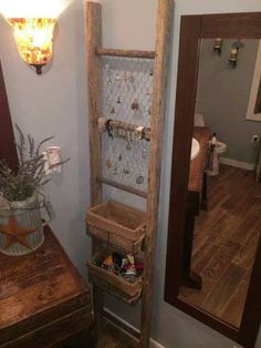 the bathroom is decorated in rustic wood and has a wooden shelf with baskets on it