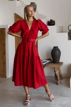 The Peony Dress is a midi-length style that will transition seamlessly from season to season. This divine beauty is crafted from hand-loomed soft linen and designed with a V-neckline, an a-line shape, and gathered puff sleeves that fuse to form this flattering dress. Featuring a fully elasticated waist it comes with a matching linen belt that gives a flattering shape to the silhouette. Complete the look with our stunning Candy heels for the romantic evening or Blossom sandals for a busy day in t Linen Belt, Peony Dress, Elf Dress, Divine Beauty, Flattering Dress, Romantic Evening, Flattering Dresses, Red Midi Dress, Wide Belt