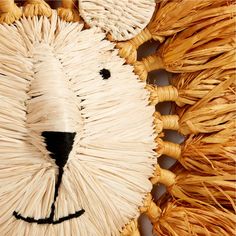 a close up of a bear made out of straw