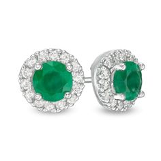 Sure to be noticed, these gemstone and diamond stud earrings are certain to bring her instant compliments. Crafted in 14K white gold, each striking earring showcases a 5.0mm certified verdant-green emerald embraced by a frame of shimmering diamonds. Captivating with 1/4 ct. t.w. of diamonds and a brilliant buffed luster, these post earrings secure comfortably with friction backs. This style arrives with a certificate that includes a photo and description of the gemstones, which guarantees qualit Diamond Halo Earrings For May Birthstone, Diamond Halo Setting Earrings For May Birthstone, White Gold Diamond Earrings With Gemstones, White Gold Round Cut Diamond Earrings With Gemstone, White Gold Diamond Earrings With Round Cut Gemstone, Brilliant Cut May Birthstone Earrings, Diamond Earrings With Prong Setting For May Birthstone, May Birthstone Diamond Earrings With Prong Setting, May Birthstone Brilliant Cut Earrings