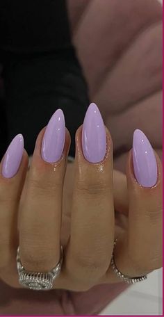 Indulge in the elegance of our exquisite collection of purple almond acrylic nails. These stylish and sophisticated nails are perfect for adding a touch of Light Purple Nail Ideas Almond, Purple Nails Lilac, Purple Nails With Design Ideas, Acrylic Nails Purple Design, Almond Nails Purple Design, Nail Colors Almond Shape, Pretty Nails Purple, Narrow Almond Nails, Purple Shades Nails