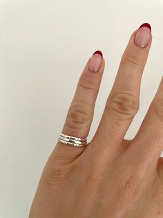 Dainty Pinky Ring Stacking Set | Recycled Sterling 925 Silver | Handmade Sterling Silver Stacking Ring Set | Hammered Solid Silver Ring | Stackable Rings | Silver Pinky Ring | Pinky Ring Woman This stacking ring set consists of three pinky rings handmade from recycled sterling silver. Each ring is 1.5mm wide and has a different texture/finish.  Handmade from 100% recycled sterling (925/solid) silver.  Recyclable packaging.  This set of rings are also available to purchase in larger sizes (link below)  https://www.etsy.com/uk/listing/1391528620/3-x-15mm-recycled-sterling-silver?click_key=8eaf5cd2e2b8b53c834510481d4cf6d0efb3d7a1%3A1391528620&click_sum=1de6e709&ref=shop_home_active_26&frs=1&sts=1 All orders include a personalised thank you note. If you would like to send as a gift with a gift Silver Pinkie Ring, Rings Inspo Silver, Ring Stacks Silver, Silver Ring Stack, Silver Pinky Ring, Pinky Rings, Multi Ring, Hand Rings, Stackable Rings Silver