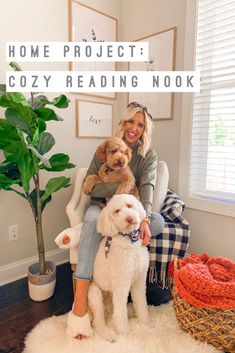 a woman sitting in a chair with two poodles and the words home project cozy reading nook