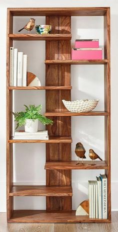 a wooden shelf with books and other items on it