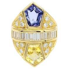 Ring Size: 6.75 An exquisitely designed cocktail ring of unparalleled beauty! This remarkable piece showcases the brilliance of natural sapphires and diamonds set in 18-karat yellow gold. The centerpiece features two large pentagon-cut natural sapphires weighing an impressive 5.33 carats with a captivating color combination of yellow and blue. A row of fifteen baguette-cut diamonds (F-G / VS1-VS2) totaling 0.73 carats is nestled between the sapphires. The diamonds are flawlessly channel-set, radiating a dazzling brilliance. The allure continues with 12 round brilliant cut diamonds, elegantly pave-set throughout the ring, totaling 0.58 carats. The sparkling diamonds add an extra touch of shimmer, enhancing the ring's overall magnificence. Crafted in 18-karat yellow gold, the setting complem Yellow Gold Cocktail Ring, Jewelry Appraisal, Contemporary Ring, Gold Cocktail Ring, Gold Cocktail, Sapphire Color, Baguette Cut Diamond, Channel Set, Yellow And Blue