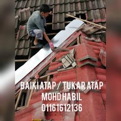 a man working on the roof of a house