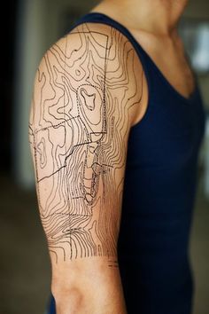 a man with a map tattoo on his arm