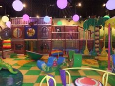 children's indoor play area with slides and toys