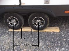 the front wheels and tires of a white truck are shown with measurements for each tire