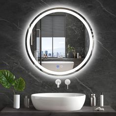 a bathroom with a round mirror above the sink and a white bowl on the counter