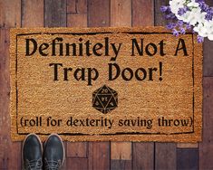 a door mat that says, definitely not a trap door roll for dextery saving throw