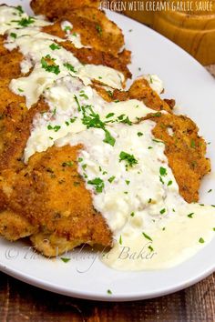 fried chicken with creamy garlic sauce on a white plate