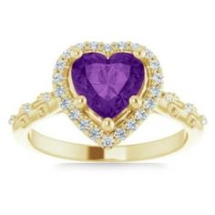 a yellow gold ring with a heart shaped amethorate surrounded by white diamonds