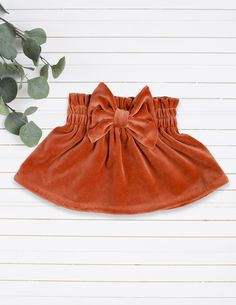 These are lovely and super soft velvet, terracotta girls skirts with bow, a perfect choice for you little lady! These skirts are handmade with love in Northern Europe, Lithuania. We use only the high quality materials, fabrics are certified according to STANDARD 100 by OEKO-TEX, so you can be sure these baby girl clothes are safe for your little one. This terracotta velvet skirt is perfect for birthdays, celebrations, photoshoots and daily games. You can choose to add a matching headband and cre 1st Birthday Outfit Girl, Orange Outfits, Skirt Bow, Girl Clothes Baby, Toddler Girl Clothes, Bow Skirt, Girls Skirts, Orange Outfit