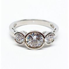 three stone diamond ring on white background