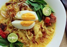 a bowl filled with noodles and hard boiled eggs