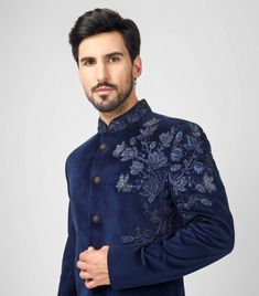 Blue Indo Western Sherwani With Floral Hand Embroidery  *Premium Quality Velvet  Fabric *Colour Blue ( Can be done in any color) * Work - Embroidery, Thread Work, Dubka Work in Antique Gold, Sequin And Beads  *Buttons - Metal Buttons In Dark Gold Note For Perfect Fitting * Pls Check Your Body Chest Exact Measurement With Out Adding Any Space or Gap From Your Side * Kindly Mention Your Height While Placing The Order 🔺Disclaimer: Product Colour May Slightly Vary Due to Photographic Lighting Sources or Your Monitor Settings Thank You for Visiting Royal Blue Long Sleeve Suit For Wedding, Reception Sherwani With Floral Embroidery, Festive Blue Embroidered Fitted Fabric, Fitted Blue Fabric With Chikankari Embroidery, Wedding Bandhgala With Floral Embroidery And Long Sleeves, Long Sleeve Sherwani With Floral Embroidery For Reception, Unstitched Zari Work Suits For Reception, Floral Embroidered Sherwani For Reception With Long Sleeves, Reception Sherwani With Floral Embroidery And Long Sleeves