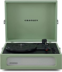 the crosley record player is green and has black lettering on its front side