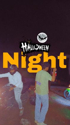 two young men standing next to each other in front of a halloween sign with the words night on it