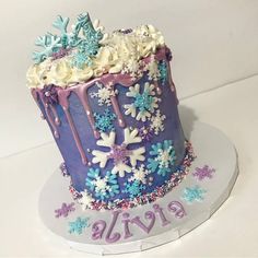 there is a cake decorated with snowflakes and icing