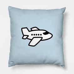 a blue pillow with a black and white airplane drawn on the front, sitting against a light blue background