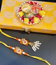 Experience the true essence of Raksha Bandhan with our Sacred Unity Rakhi Set. This set includes not only the heartwarming Bhaiya Rakhi and elegant Lumba Bhabhi Rakhi but also a thoughtful rice/sindoor holder. It's a complete ensemble that embodies the love and unity shared between siblings and in-laws. Combo contains: 1 Box 1 Haldi/Rice/Sindoor Holder 1 Rakhi pair  The bhabhi Rakhi is designed to be tied on bracelet/bangle/watch.  The color of the box will be random. Please message us if you want any particular color and we will be there to find the best option for you. Multicolor Sets For Navratri Gift, Traditional Multicolor Gift Sets, Handmade Gift Sets For Diwali, Multicolor Sets With Latkans For Gifts, Multicolor Sets For Festivals As Gifts, Multicolor Sets For Festivals And Gifts, Multicolor Festival Sets As Gift, Traditional Gift Sets For Festivals, Traditional Festival Gift Sets