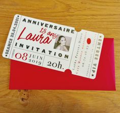 a red envelope with a ticket for an event