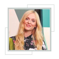 a woman with long blonde hair wearing a black and white floral shirt is smiling at the camera