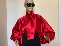 "This is a very stylish Womens Satin blouse in beautiful Candy apple red color. It is comfortable and cozy. Made for a free flowing fit. Great for all year around and for any special occasion or casual day can be dressed up or dressed down. SIZE CHART SIZE S - US 6, UK 8, EU 36 bust: bust around 34.5\"/90cm Waist: waist around 27.5\"/70cm Hips: hips around 34.5\"/90cm SIZE M - US 8, UK 10, EU 38 bust: bust around 37.5\"/95cm Waist: waist around 29.5\"/75cm Hips: hips around 37.5\"/95cm SIZE L - Puffy Blouse, Satin Bow Blouse, High Neck Shirt, Blouse High Neck, Black Satin Blouse, Bishop Sleeve Blouse, Victorian Collar, Red And Black Outfits, High Neck Shirts