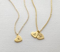 A beautiful heart necklace hand-stamped with your choice of letter initials. This multiple heart initial necklace is perfect for moms, mothers, grandma, grandmothers, girlfriends, wife, wives etc. Carry your loved ones with you wherever you go! Matte Gold 10mm gold-plated hearts, hand stamped with your choice of uppercase or lowercase letters. Choose between a gold plated or 14k gold filled chain. DETAILS: - 10mm heart stamped with UPPERCASE or lowercase initials - Matte Gold finish - Hand-stamp Dainty Hand Stamped Charm Necklace For Anniversary, Dainty Hand-stamped Charm Necklace For Anniversary, Anniversary Dainty Hand-stamped Charm Necklace, Dainty Stamped Charm Necklaces For Anniversary, Dainty Stamped Charm Necklace For Anniversary, Mother's Day Initial Pendant Charm Necklace For Anniversary Gift, Dainty Stamped Charm Necklaces For Mother's Day, Personalized Heart Pendant Charm Necklace For Everyday, Mother's Day Initials Charm Necklaces For Mom