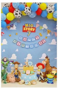 an image of a birthday party with toys and decorations on the table in front of it