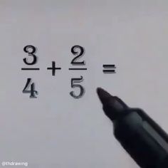 a close up of a pen writing on a piece of paper with numbers written in it